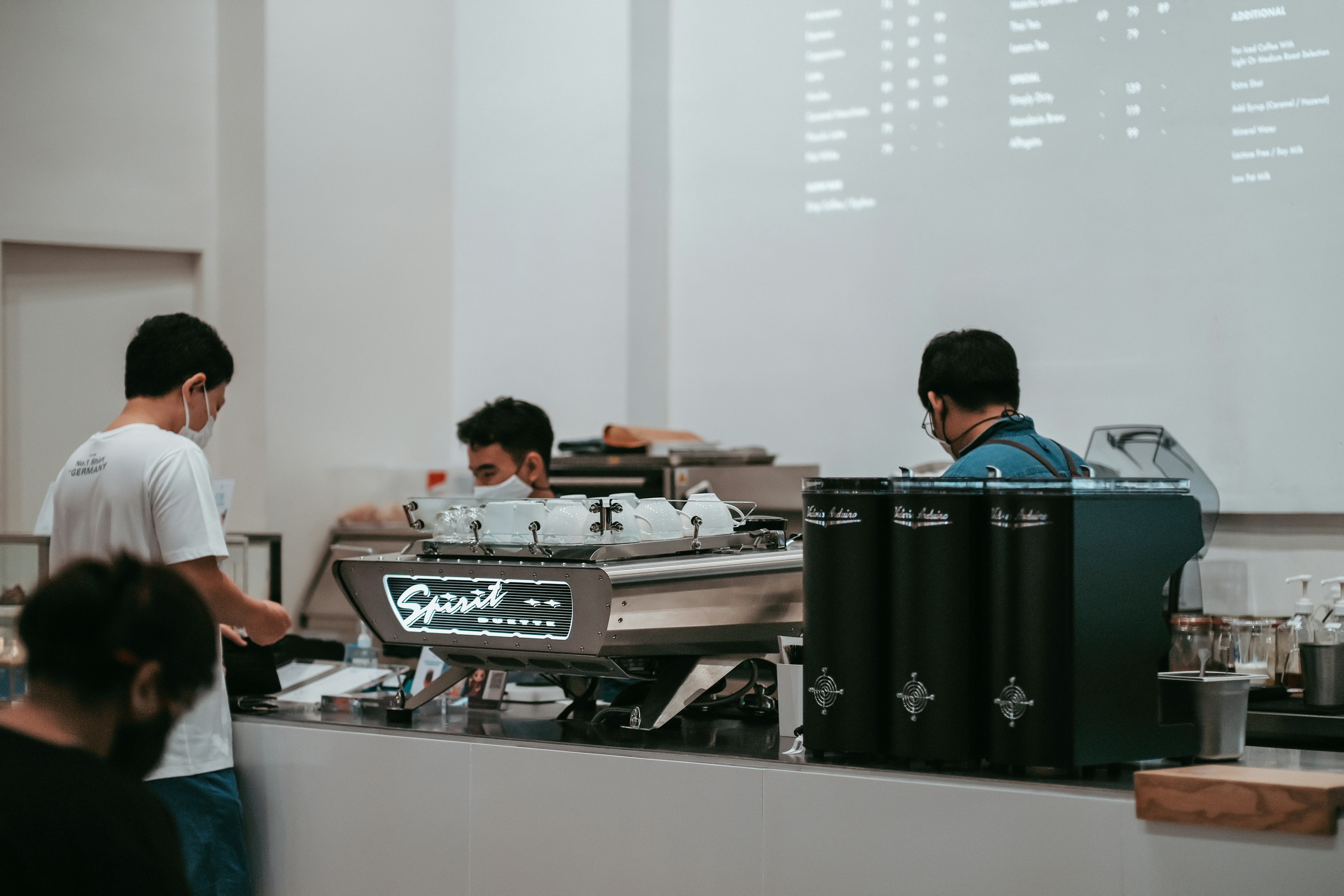 Builders setting up deployment pipeline with coffee